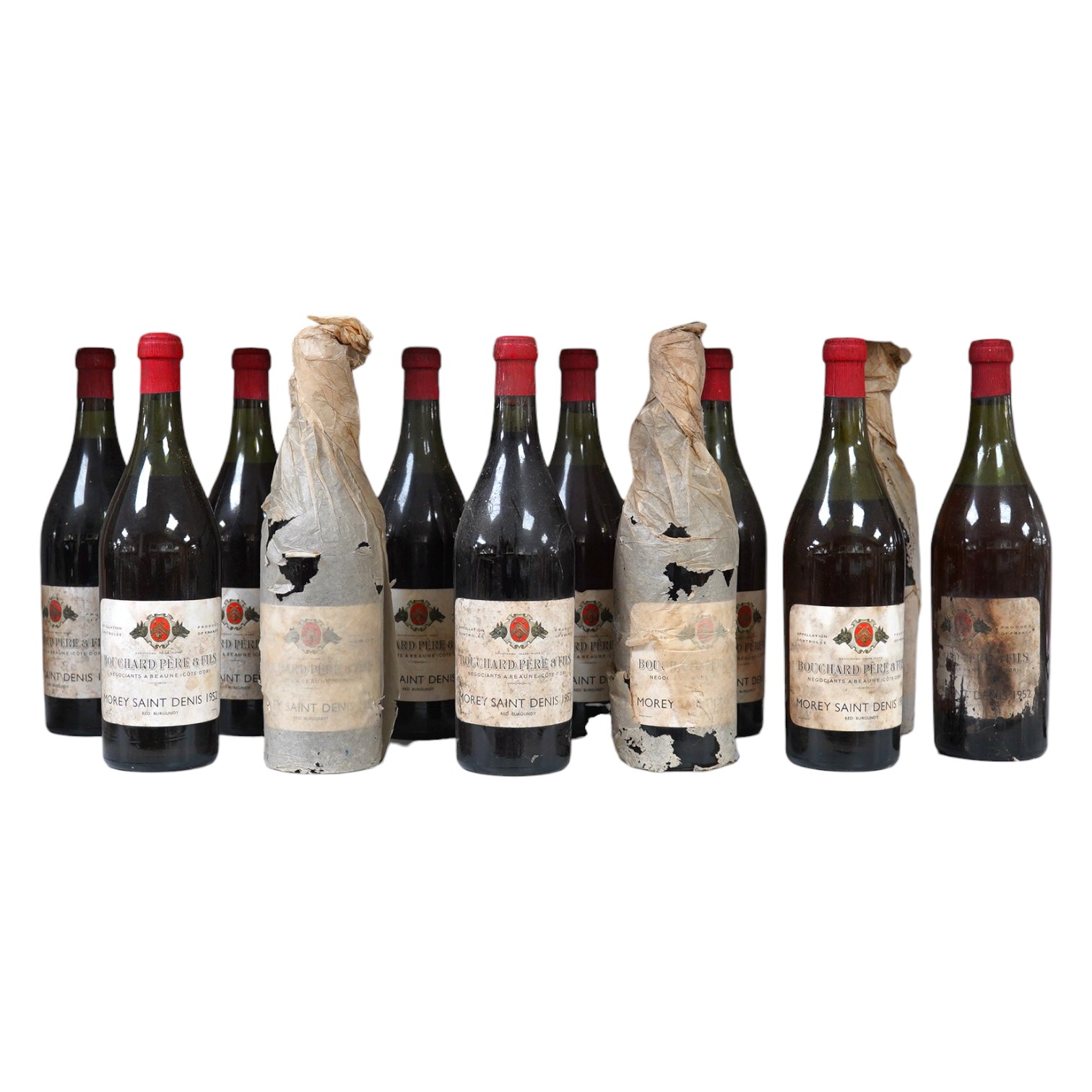 Twelve bottles of 1952 Bouchard Pere & Fils Morey Saint Denis red burgundy. Condition - fair to good, storage history unknown